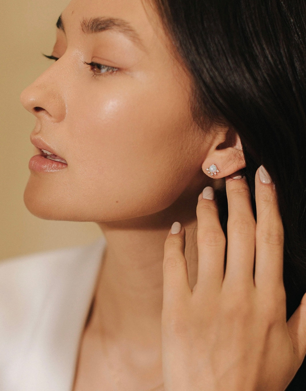model wearing Juno Stud Earrings by Lover's Tempo in a Simulated Opal with 5 Cubic Zirconia stones