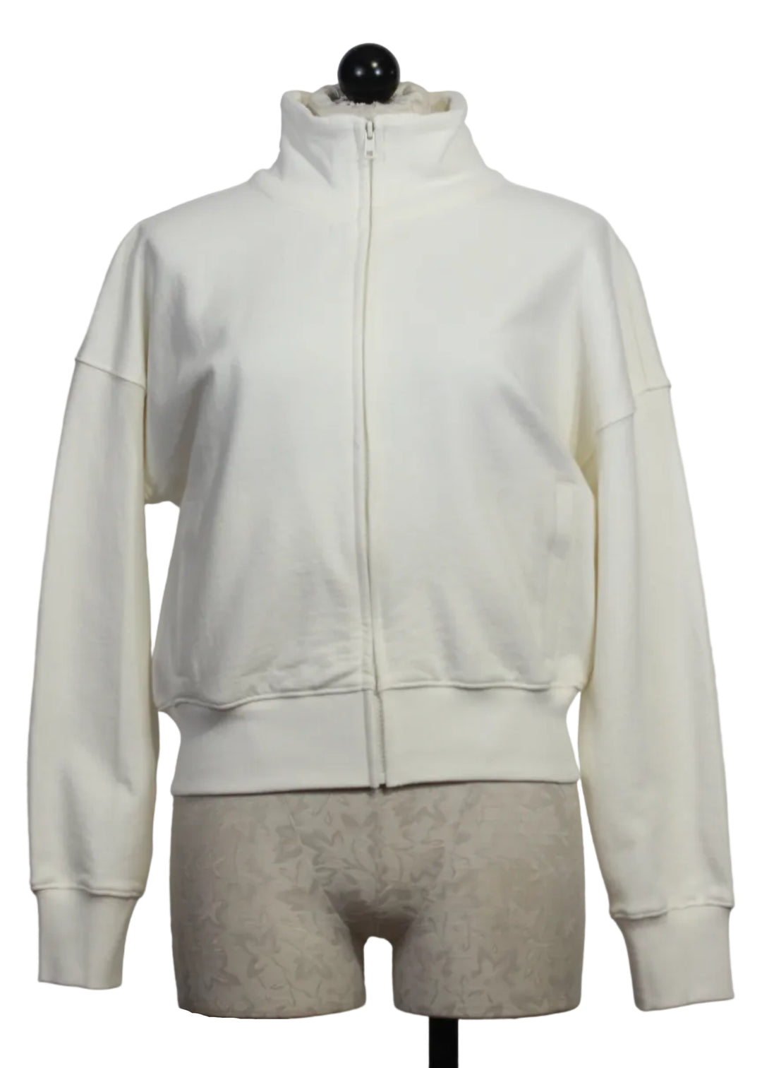 Cream Colored Zip Up Mock Neck Sweatshirt by Kerri Rosenthal with taupe-colored heart patches on the sleeves