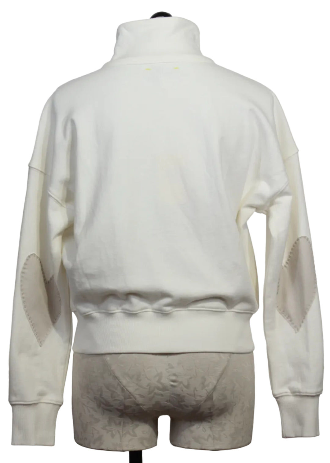 back view of Cream Colored Zip Up Mock Neck Sweatshirt by Kerri Rosenthal with taupe-colored heart patches on the sleeves