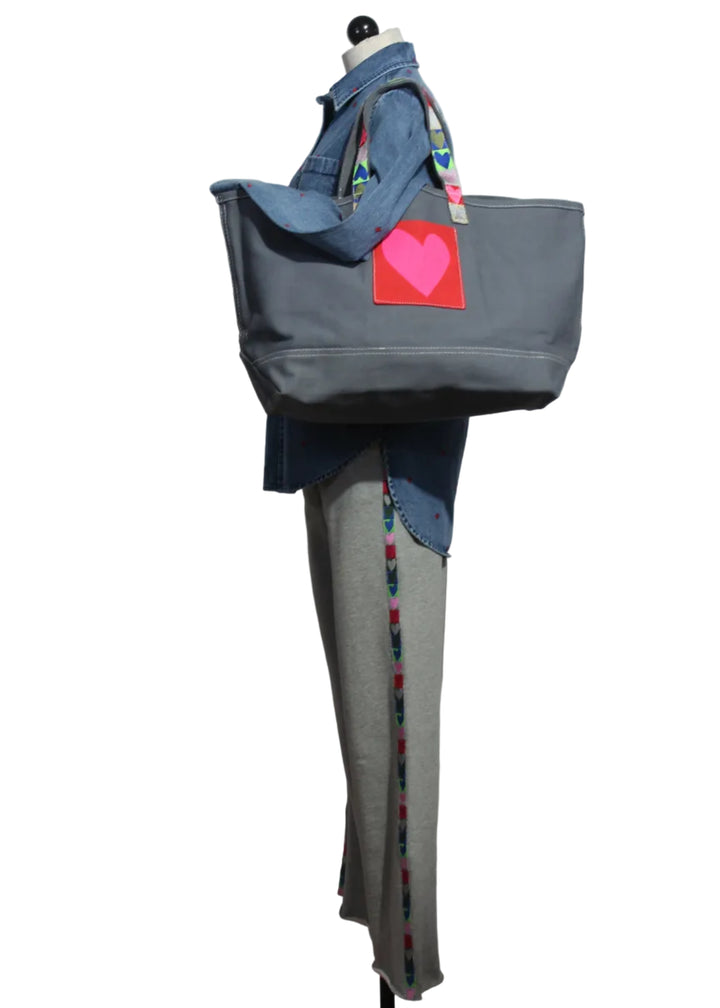 side view of the Weekend Love Brigade Sweatpants and Mia Tiny Hearts Denim Shirt by Kerri Rosenthal paired with the Love All Over Tote