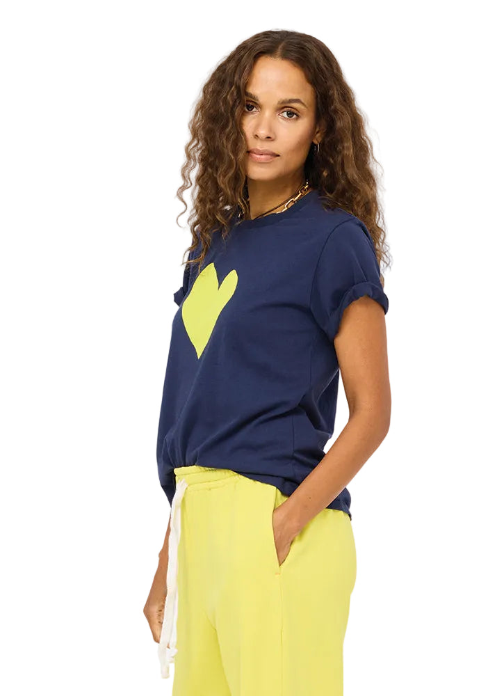 side view of model wearing the Indigo Blue Cactus Suke Imperfect Heart Tee by Kerri Rosenthal