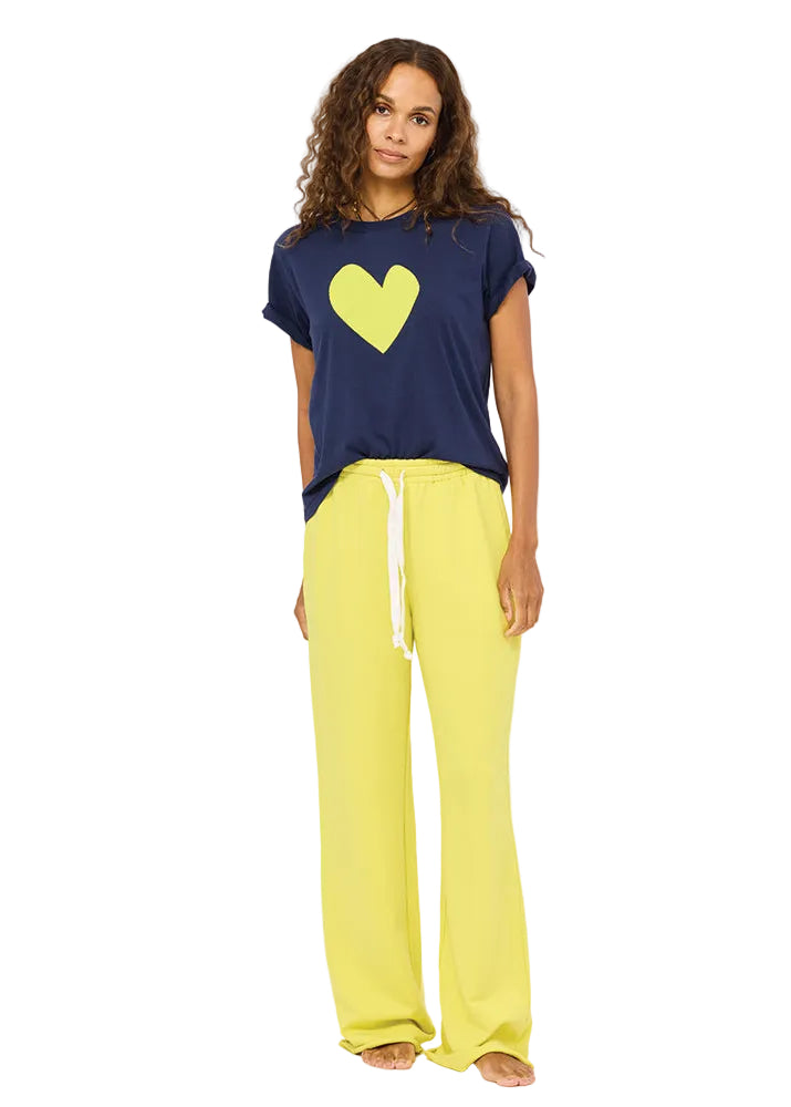 model wearing the Indigo Blue Cactus Suke Imperfect Heart Tee by Kerri Rosenthal and the Cactus colored Weekend Barb Sweatpant by Kerri Rosenthal