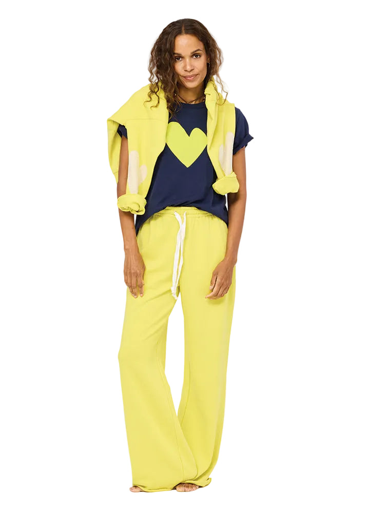 model wearing the Cactus Ex-Boyfriend Patchwork Sweatshirt by Kerri Rosenthal paired with the Cactus Weekend Barb Pant by Kerri Rosenthal and the Blue Indigo Cactus Suke Imperfect Heart Tee by Kerri Rosenthal