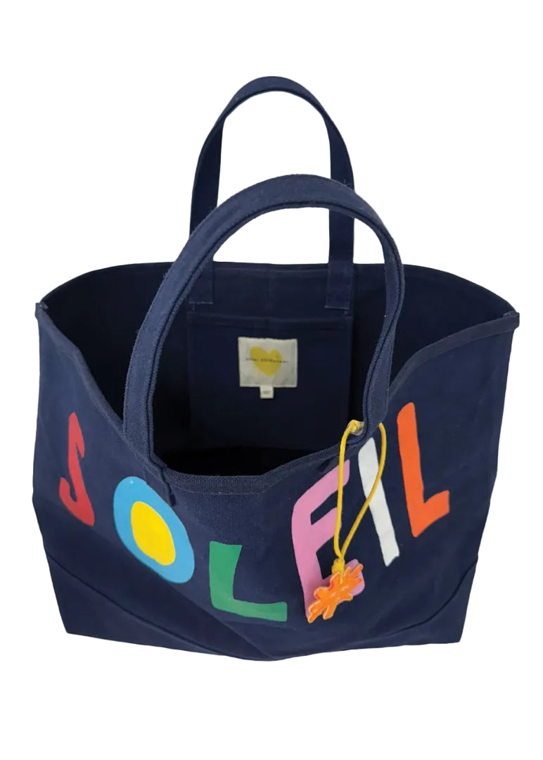 inside view of the Soleil Beach Tote with pocket by Kerri Rosenthal in navy indigo blue 