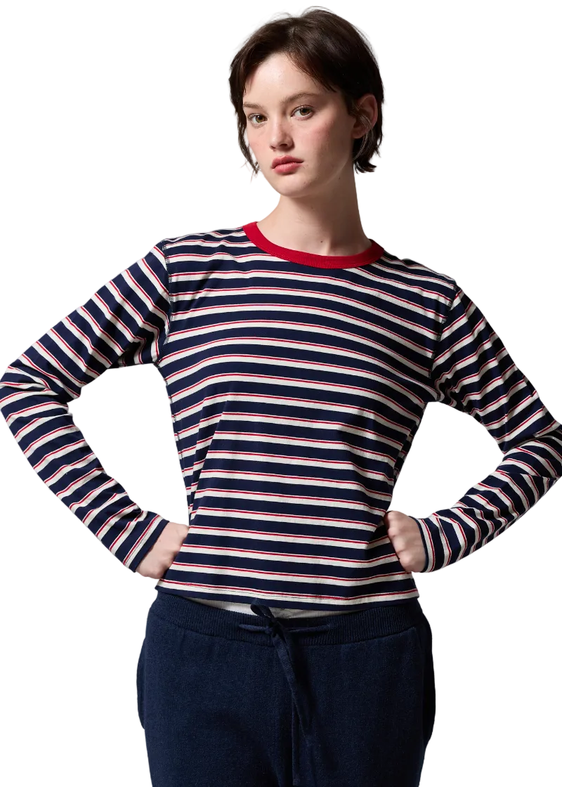 Model wearing the Navy and Natural Lucy Long Sleeve Stripe Tee by Asher with a red trim Crew neckline