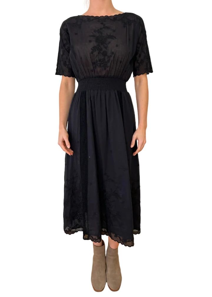 model wearing the BLACK XOCHI Short Sleeve Midi Dress by Johnny Was