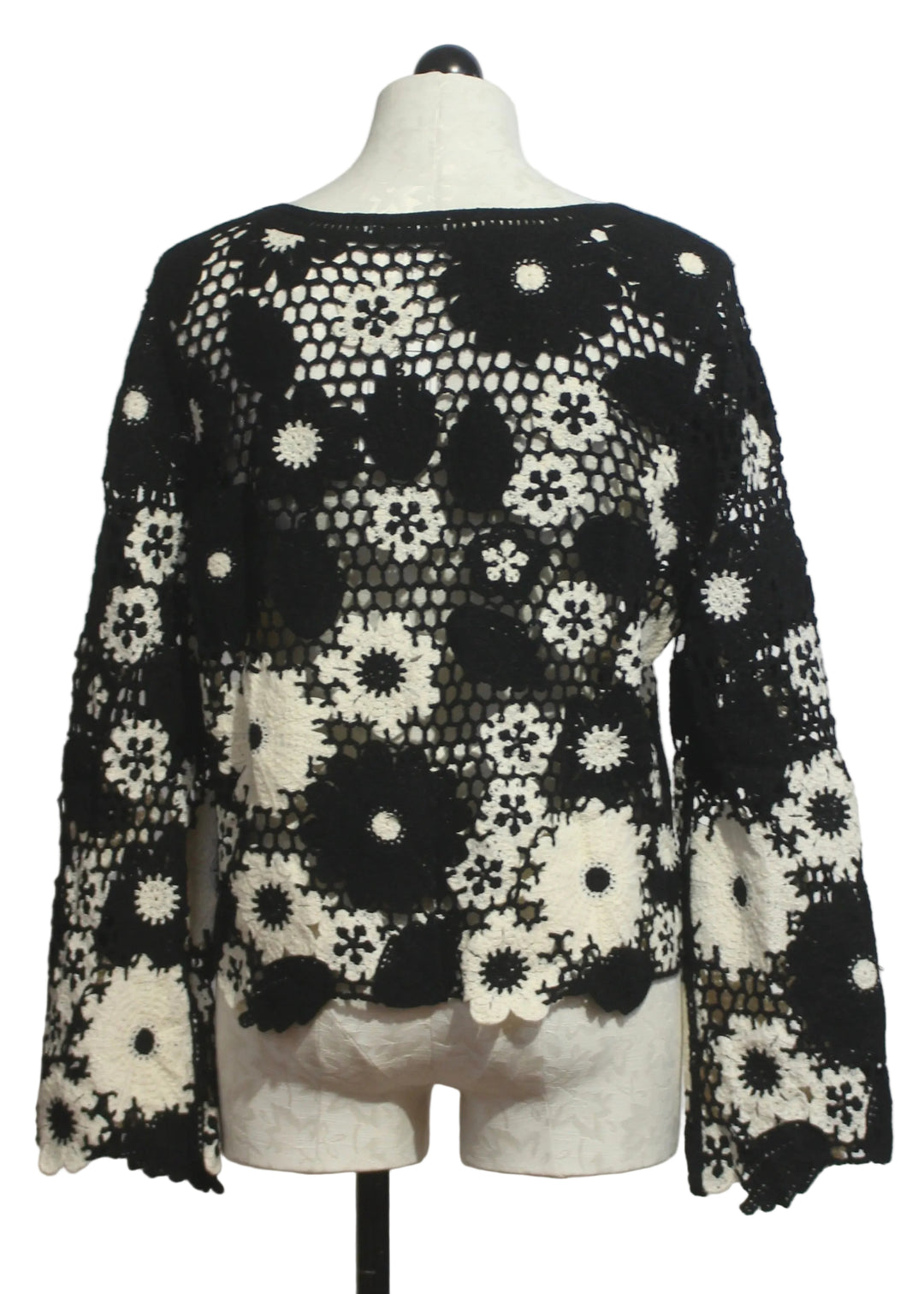 back view of Black and White Floral Crochet Pullover by Adore 