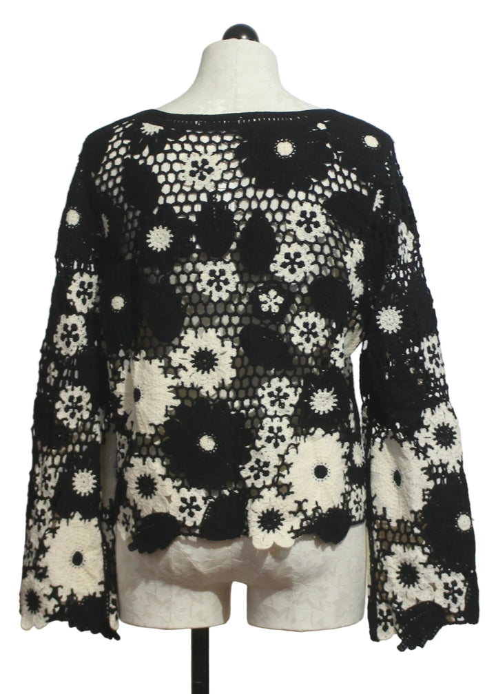 back view of Black and White Floral Crochet Pullover by Adore 