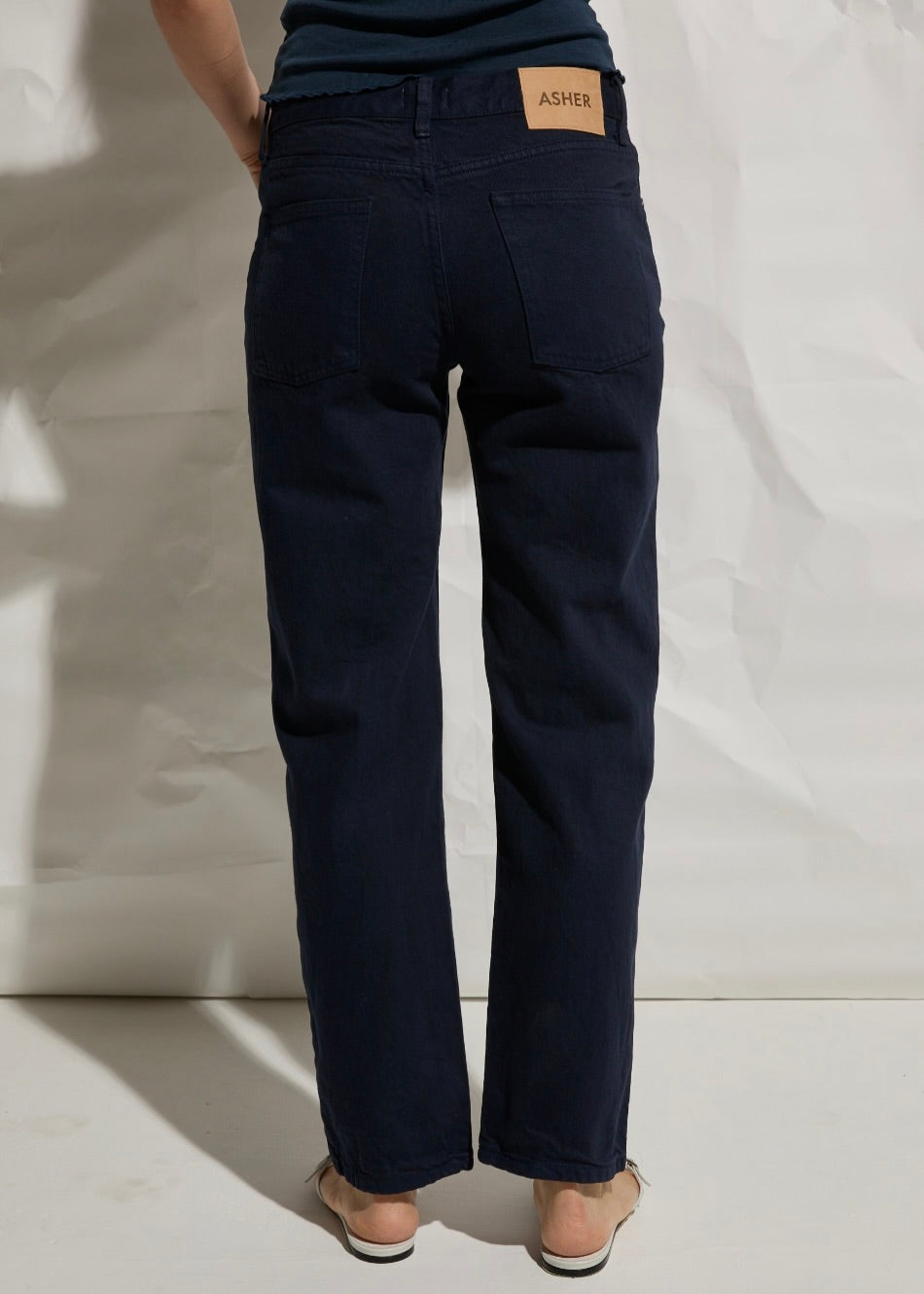 back view of model wearing The Alma Jeans in Outer Space by Asher