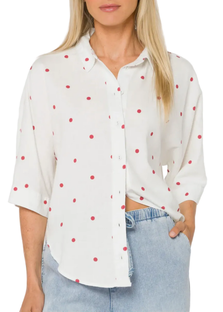 model wearing the Optic White Merle Cardinal Red Polka Dot Shirt by Velvet Heart 