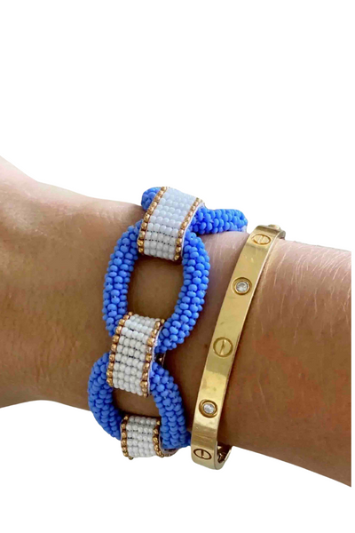 model wearing Periwinkle Blue Links Beaded Bracelet by Beth Ladd Collections with another gold bracelet
