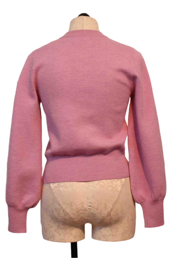 back view of Pink Sweet MGALIA Blouson Sleeve Cardigan by Berenice with silver snap buttons