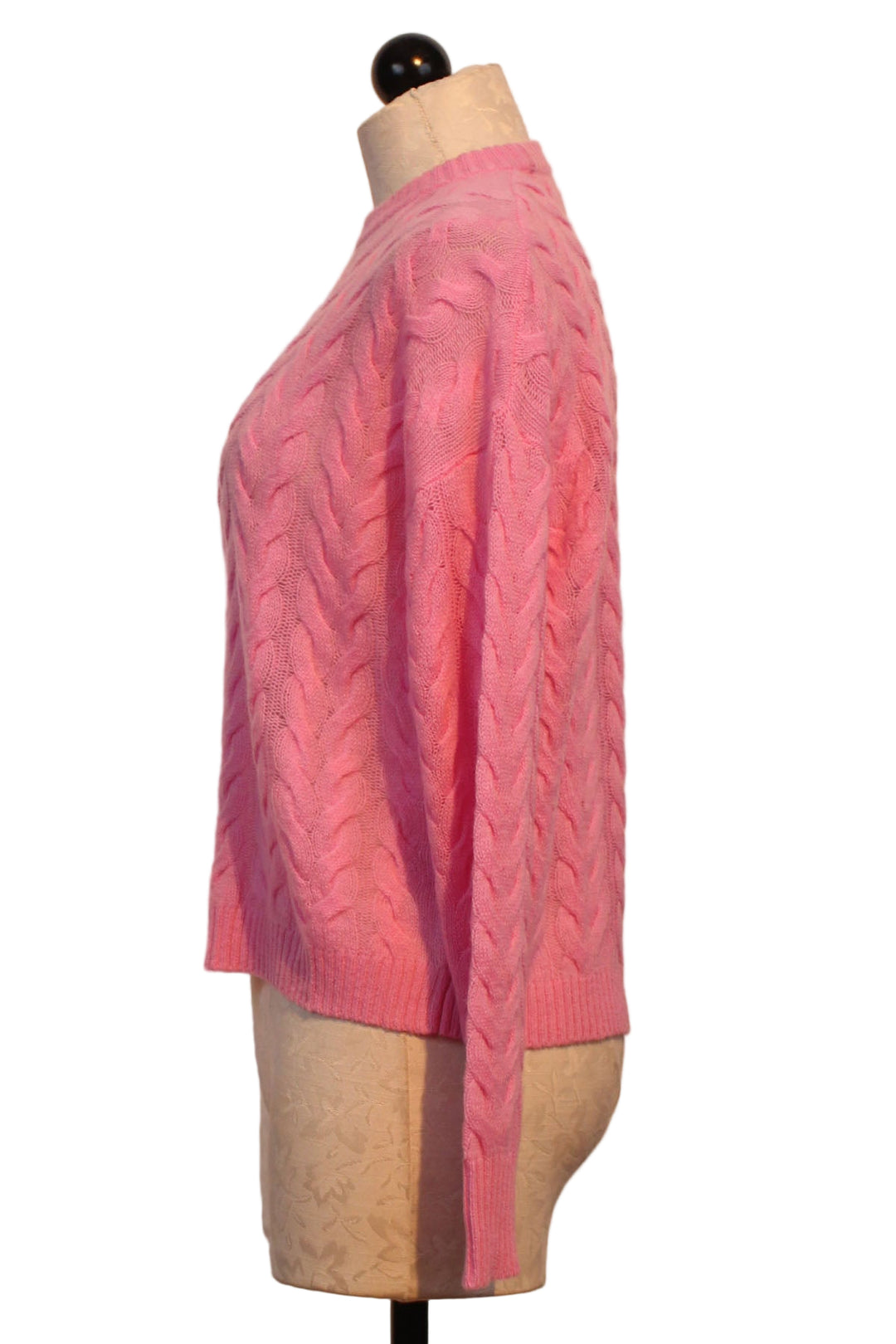 side view of Glam Pink All Over Cable Crewneck Sweater by Alashan Cashmere