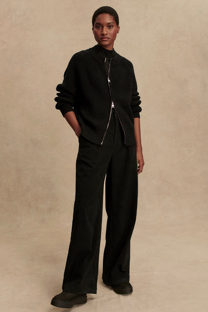 The Black Milo Zip Through Knit Jacket by Varley paired with the Black Floris Wide Leg Pant by Varley 