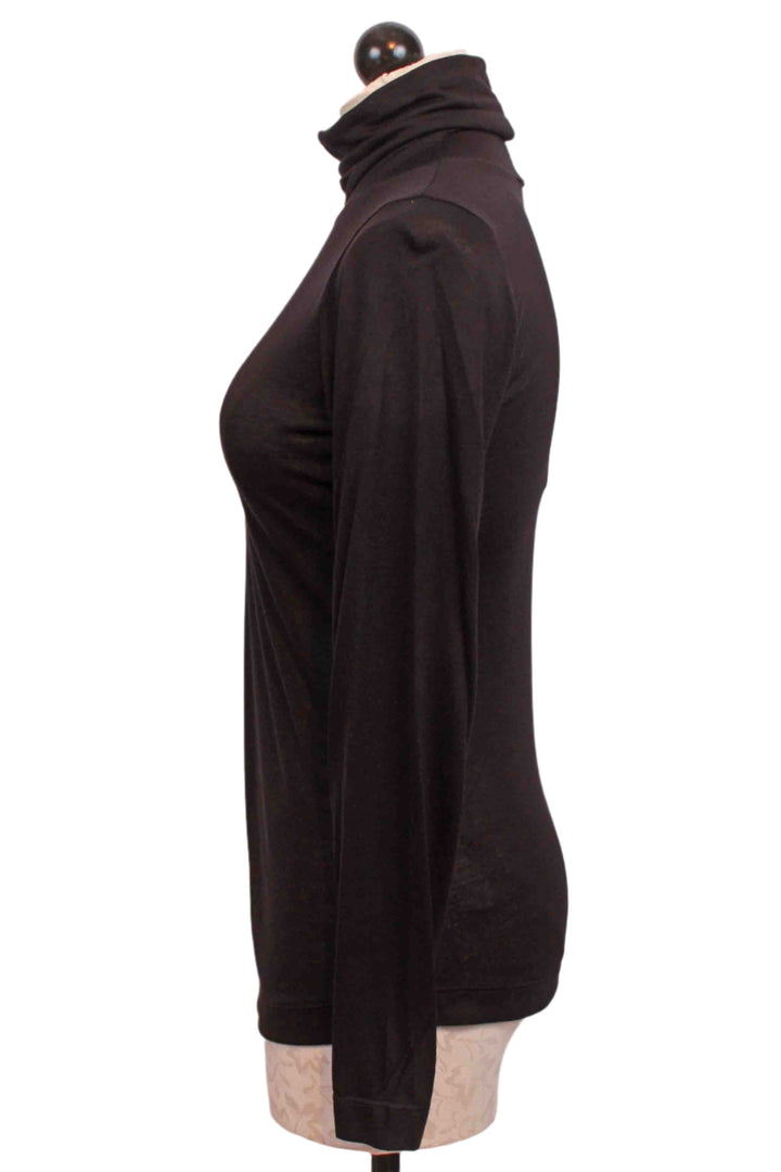 side view of Black Modal Jersey Long Sleeve Turtleneck Top by Nally and Millie