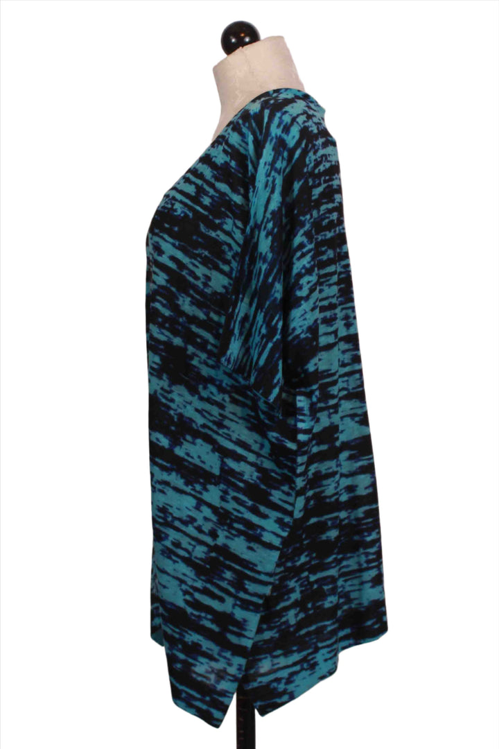 side view of turquoise and navy V-neck Oversized Static Print Short Sleeve Top by Nally and Millie