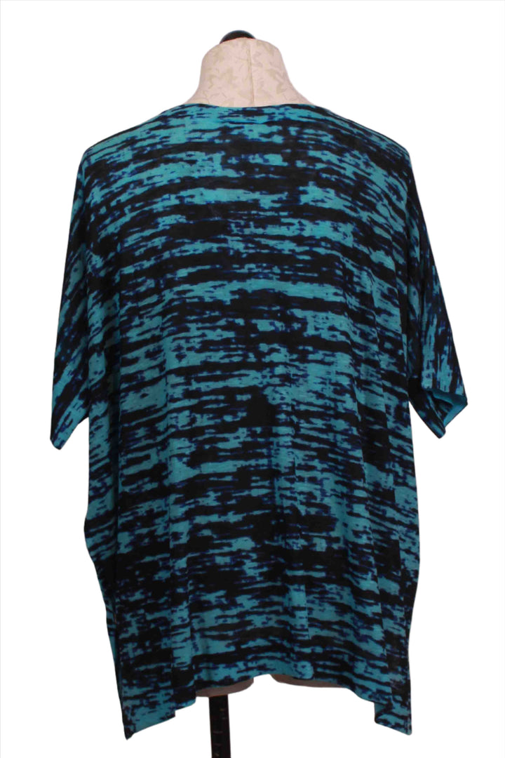 back view of turquoise and navy V-neck Oversized Static Print Short Sleeve Top by Nally and Millie