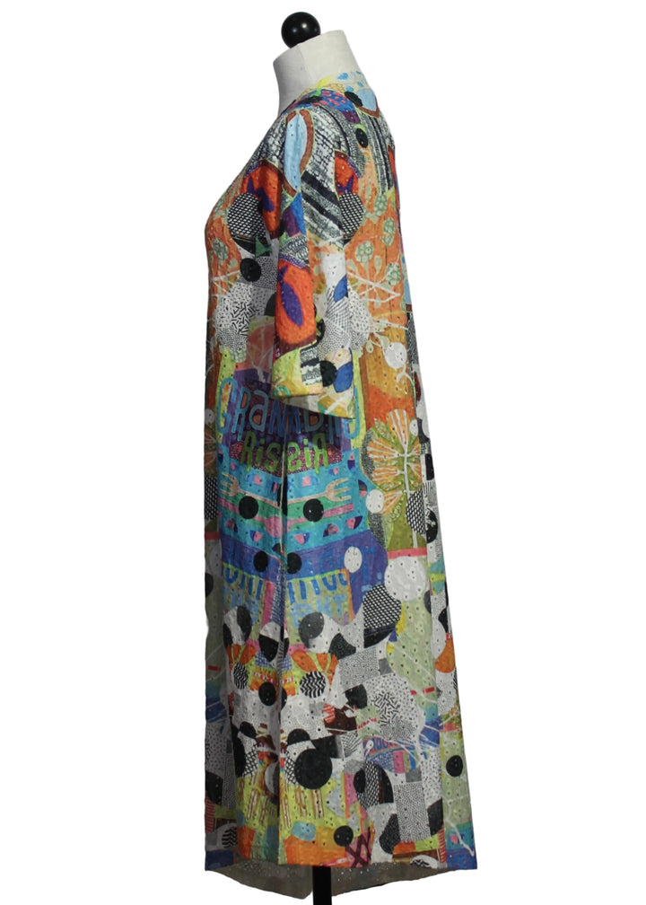 side view of The Funky Seed Short Sleeve Asymmetrical Hem Dress by Inoah 
