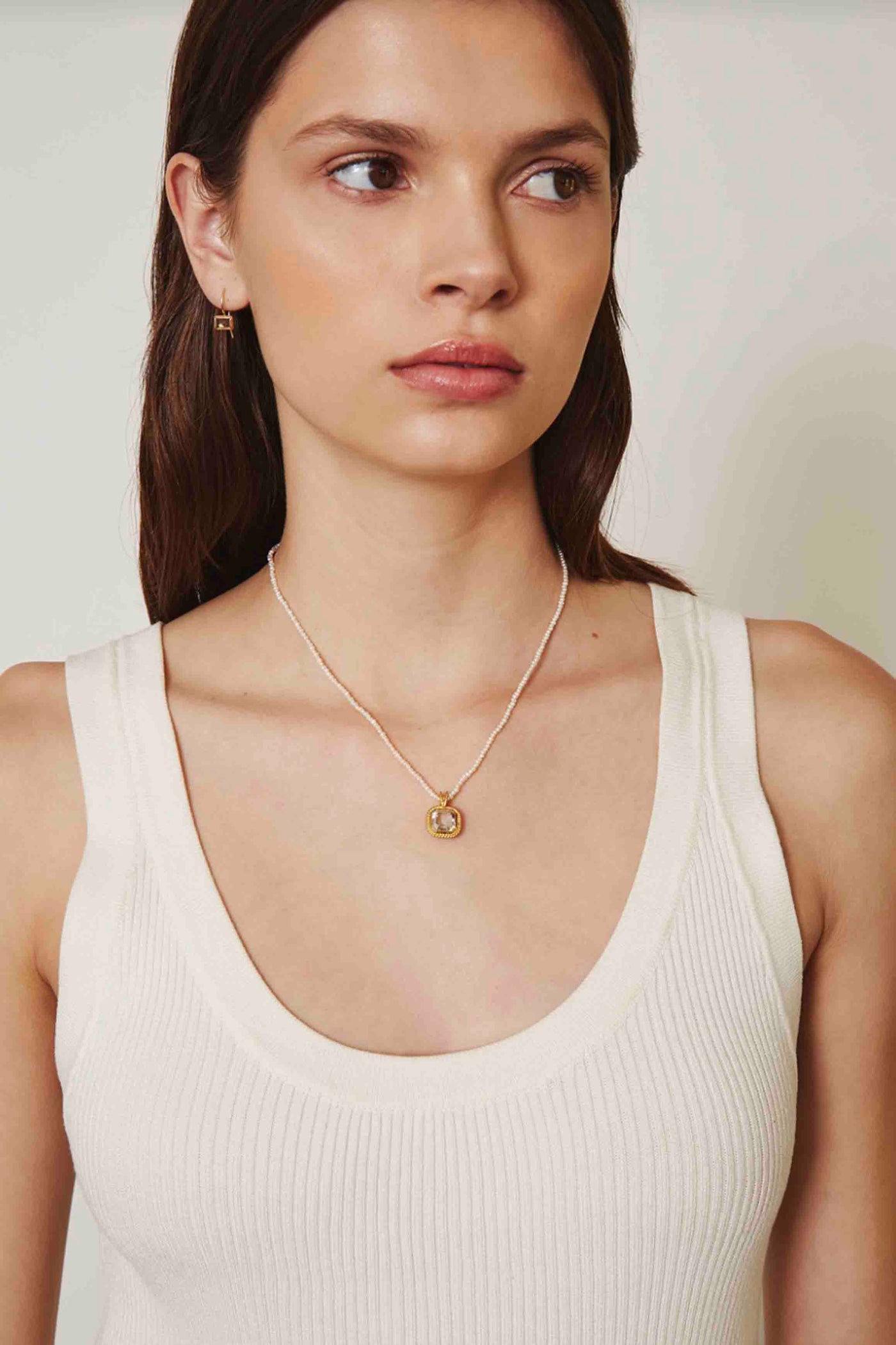 Model wearing the White Pearl Necklace with Bezel Silver Shade Crystal by Chan Luu