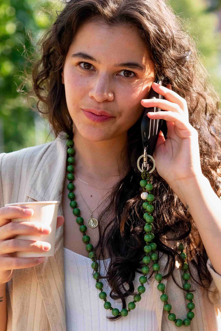 girl using the Handmade Knotted The PALM Kelly Green Beaded CellPhone Chain by Dropletsy 