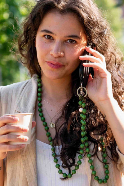 girl using the Handmade Knotted The PALM Kelly Green Beaded CellPhone Chain by Dropletsy 