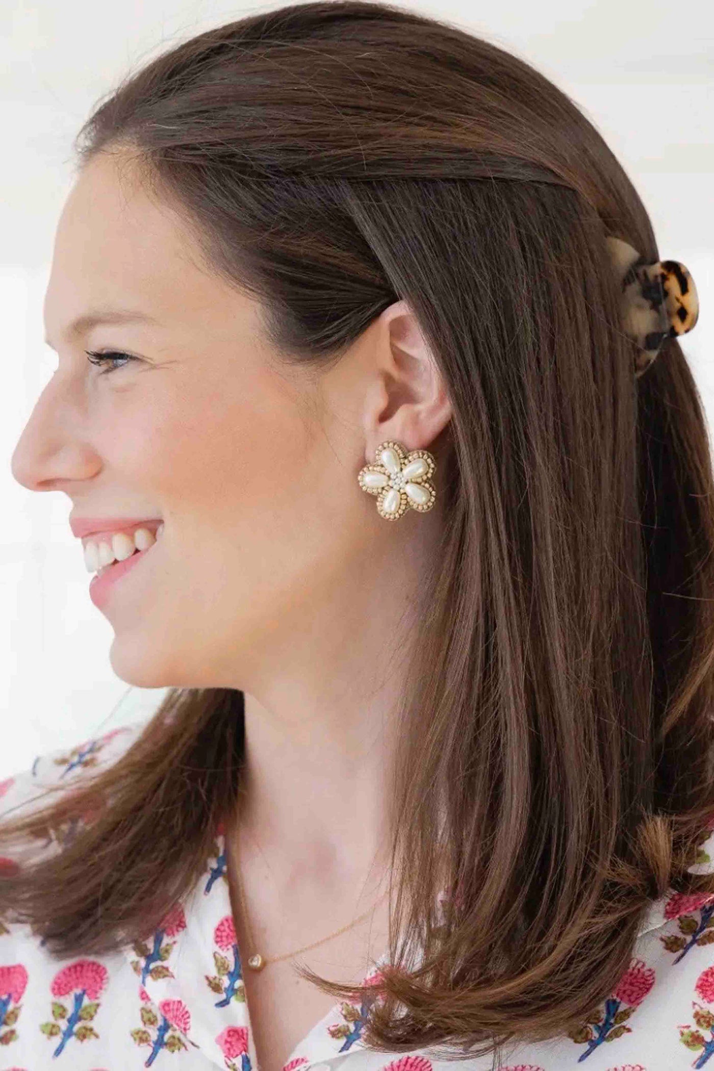 model wearing the Pearl Flower Stud Earrings by Beth Ladd Collections
