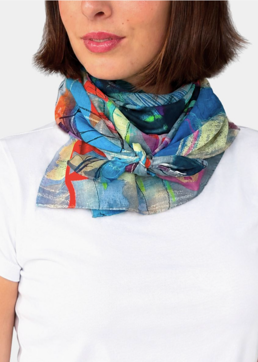model wearing the 37.5 x 37.5" Square Roadmap Cotton Scarf by Isabelle Gougenheim Designs