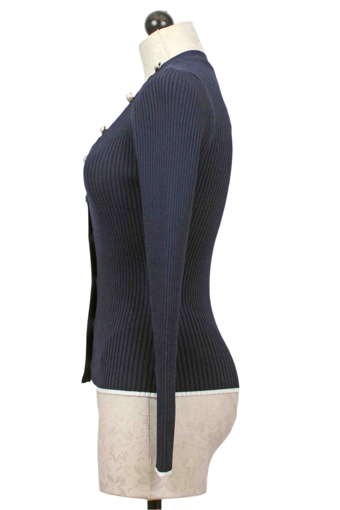 side view of Ribbed Navy Renata Cardigan by Generation Love with White trimmed bottom hem