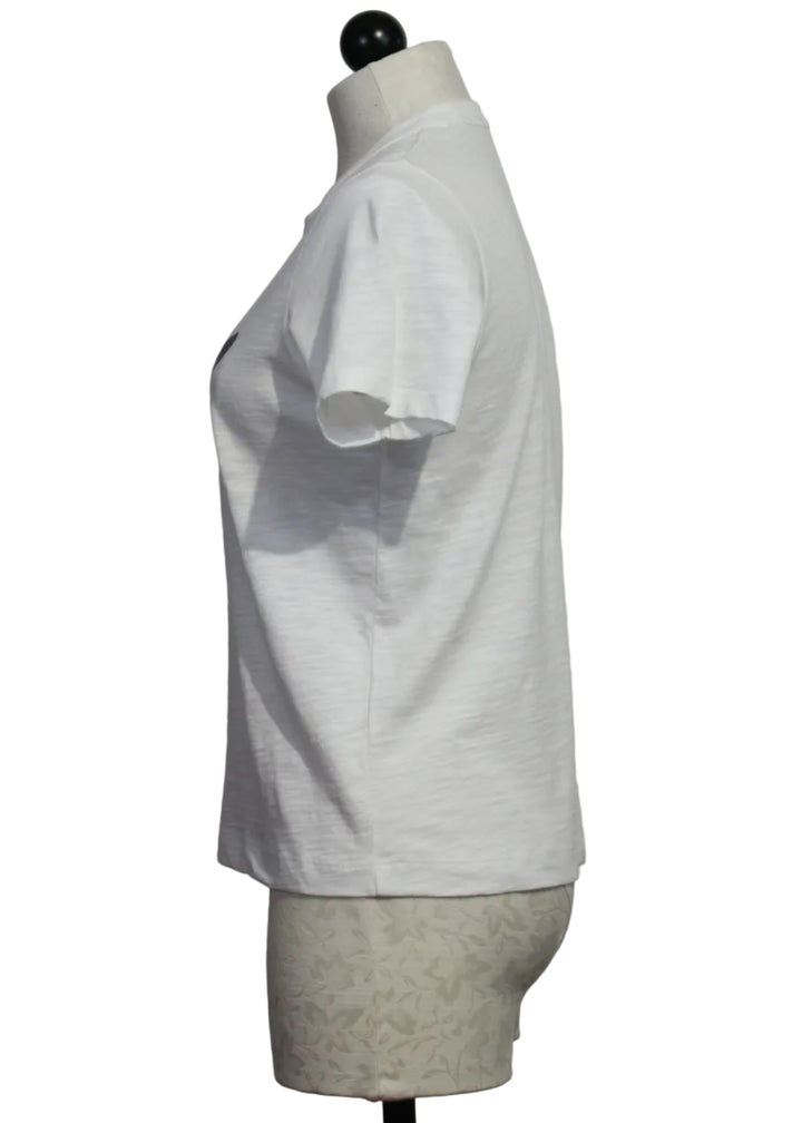side view of The Jaw Dropping Cotton Tee by Lisa Todd in White