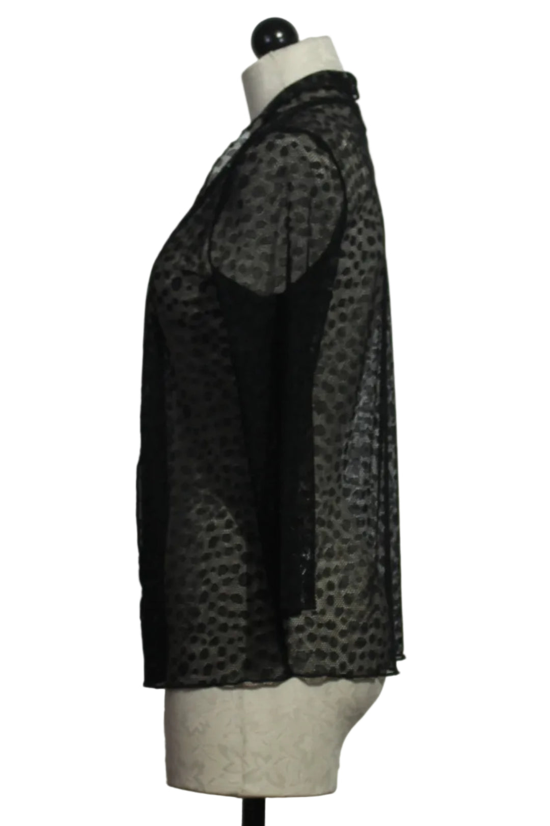 side view of The sheer black polka dot Meem Jacket by Kozan is an effortless black unlined sweater jacket