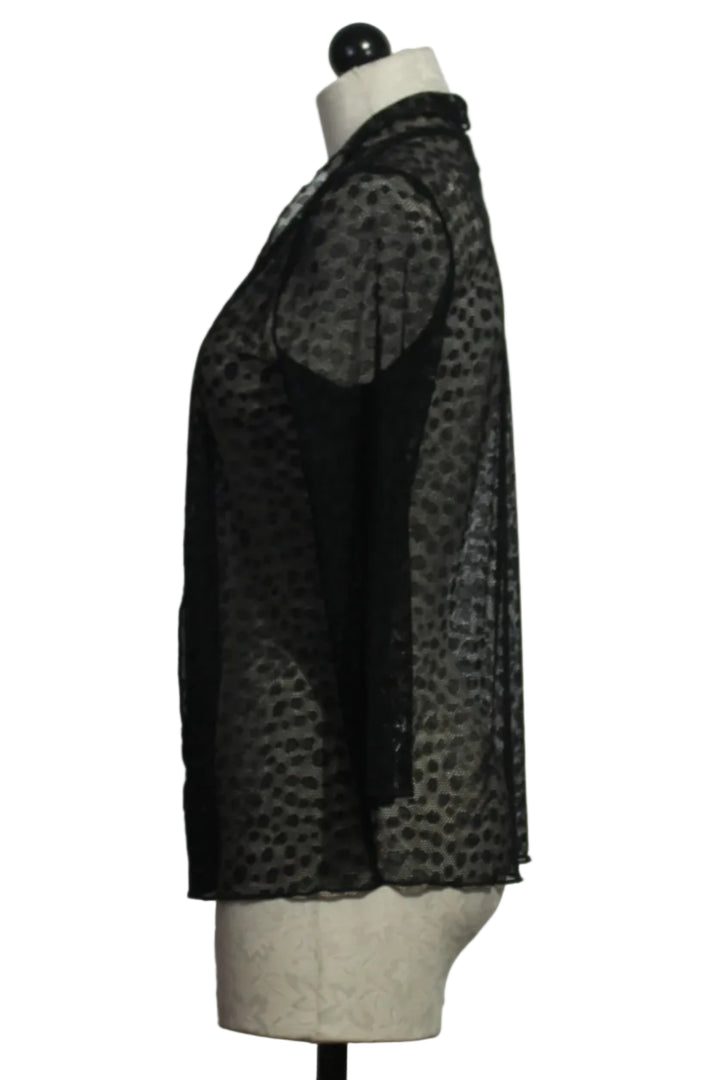 side view of The sheer black polka dot Meem Jacket by Kozan is an effortless black unlined sweater jacket