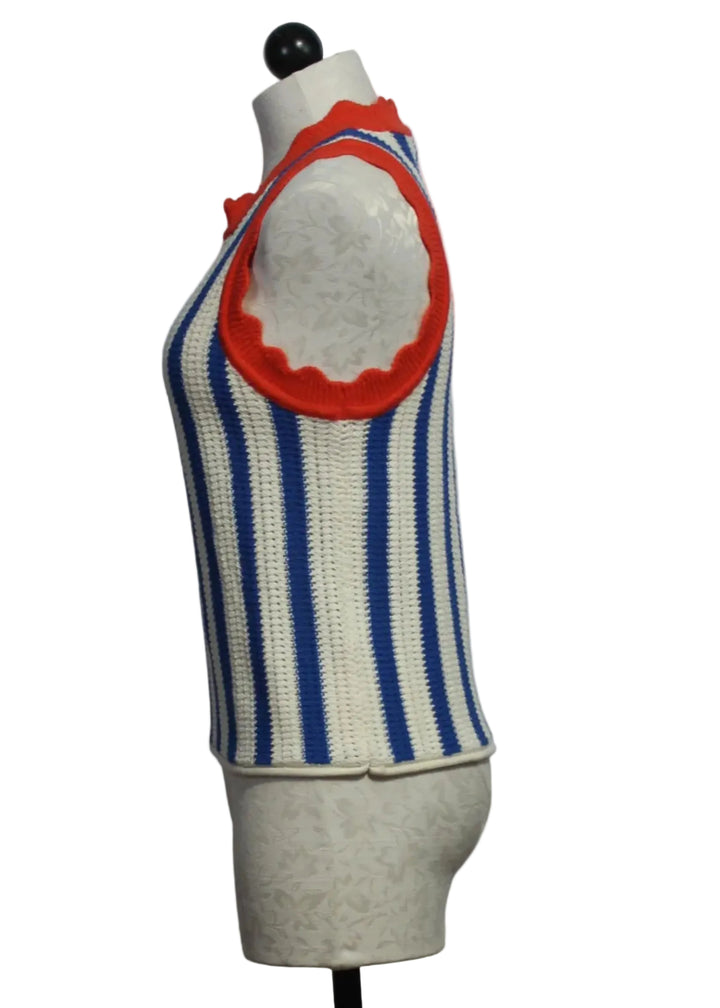 side view of Sleeveless Azul Top by Melissa Nepton in bright blue and white vertical stripes  and bright red scalloped neckline and armholes
