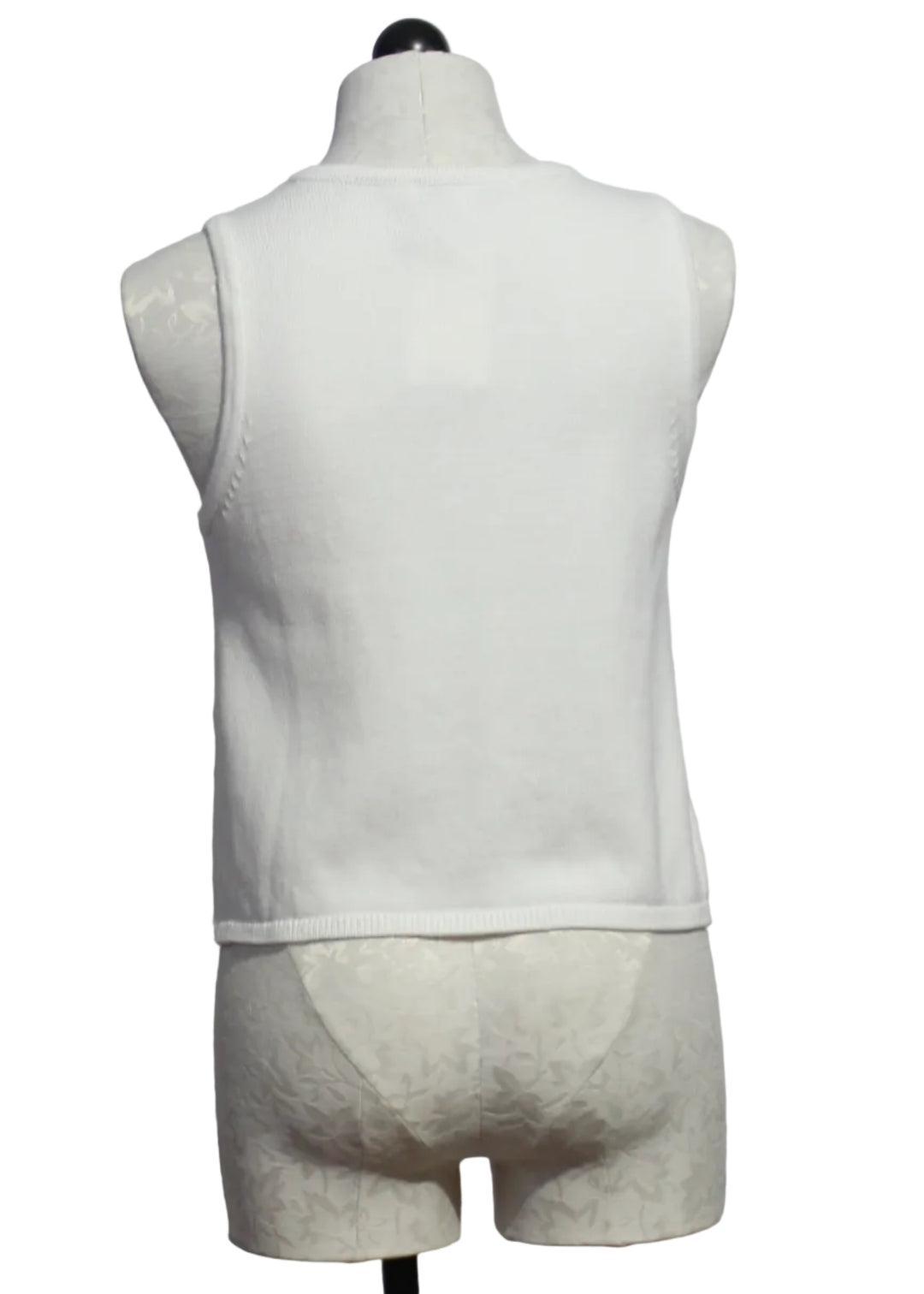 back view of Off-White sleeveless button-down Freesia Top by Melissa Nepton with with an orange jacquard design on each front side 
