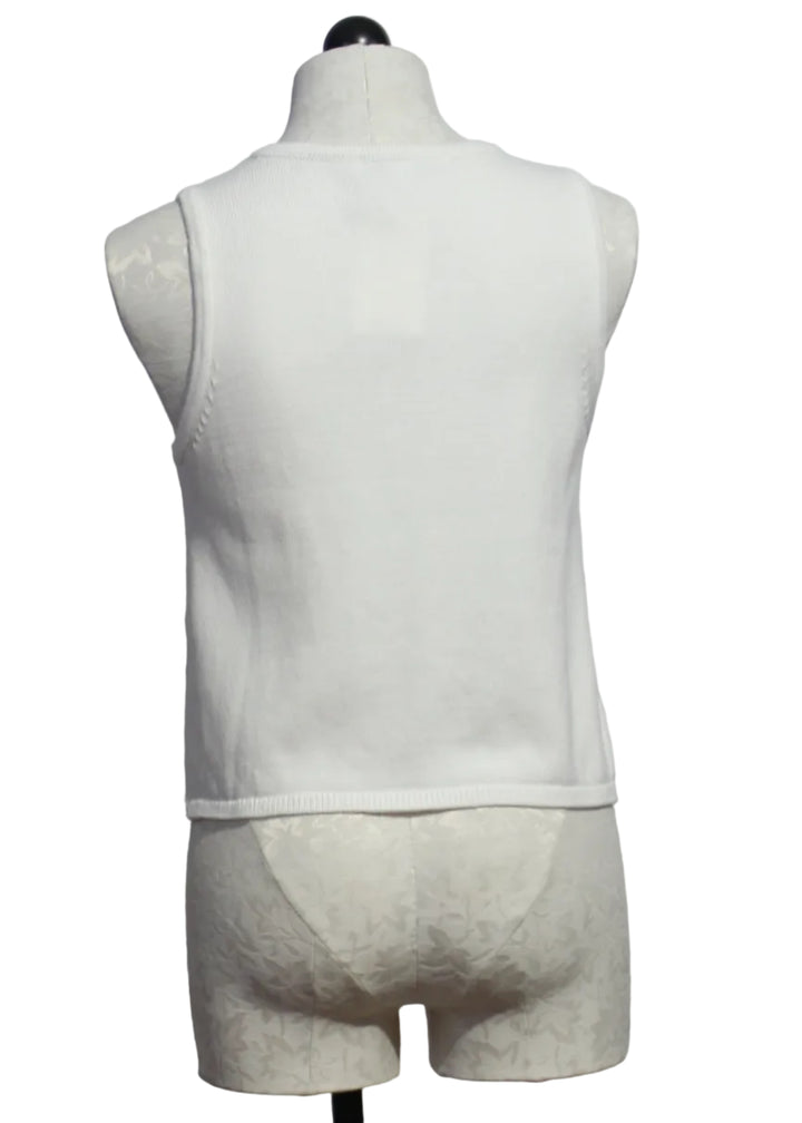 back view of Off-White sleeveless button-down Freesia Top by Melissa Nepton with with an orange jacquard design on each front side 