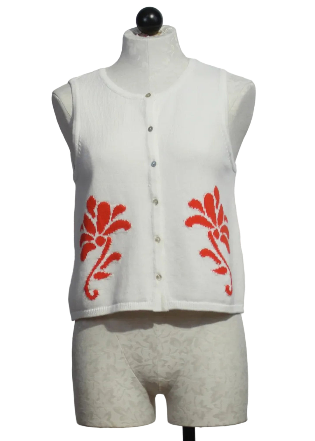 Off-White sleeveless button-down Freesia Top by Melissa Nepton with with an orange jacquard design on each front side 