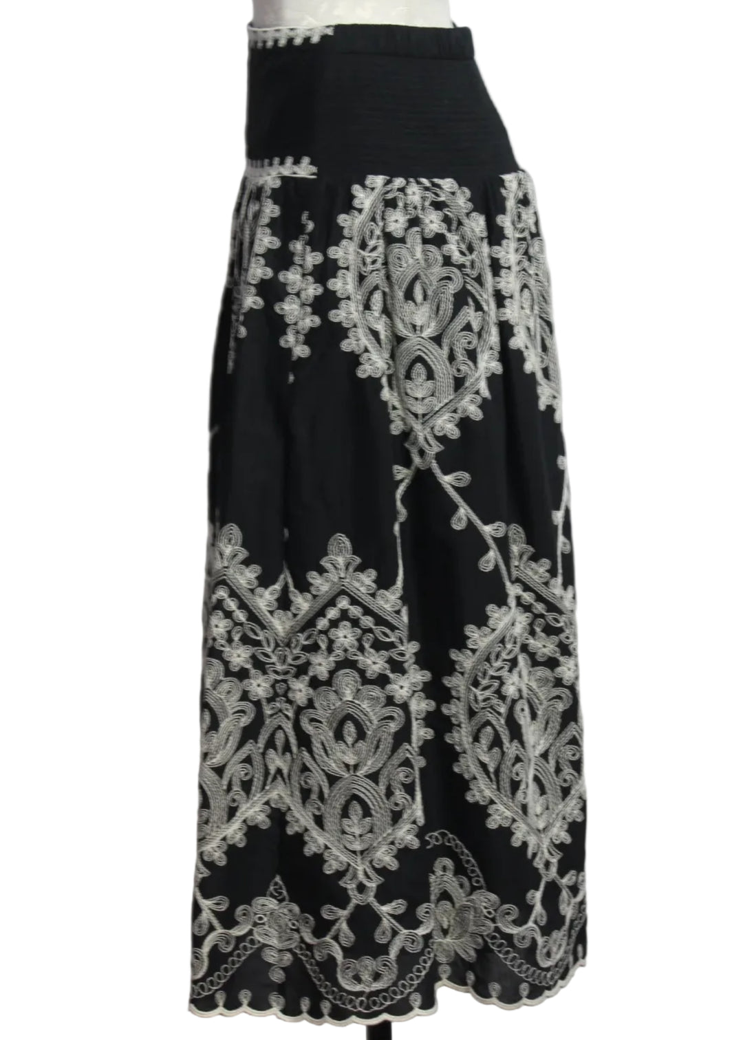 side view of the Noir colored Embroidered Georgina Midi Skirt by Cartolina