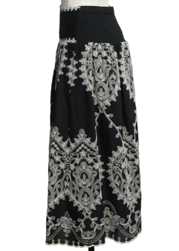 side view of the Noir colored Embroidered Georgina Midi Skirt by Cartolina