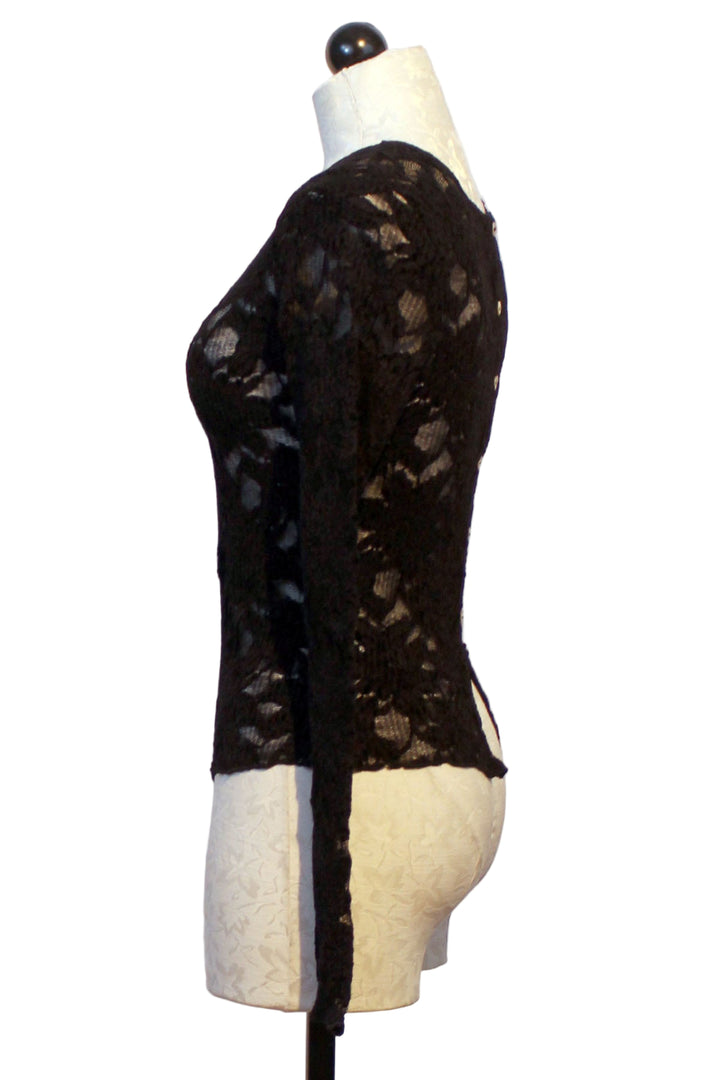 side view of Flower Textured Stretch Top by Jessie Lui