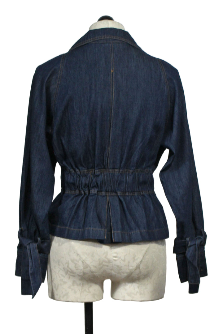 back view of Blue Denim Susan Belted Denim Jacket by Emily Lovelock