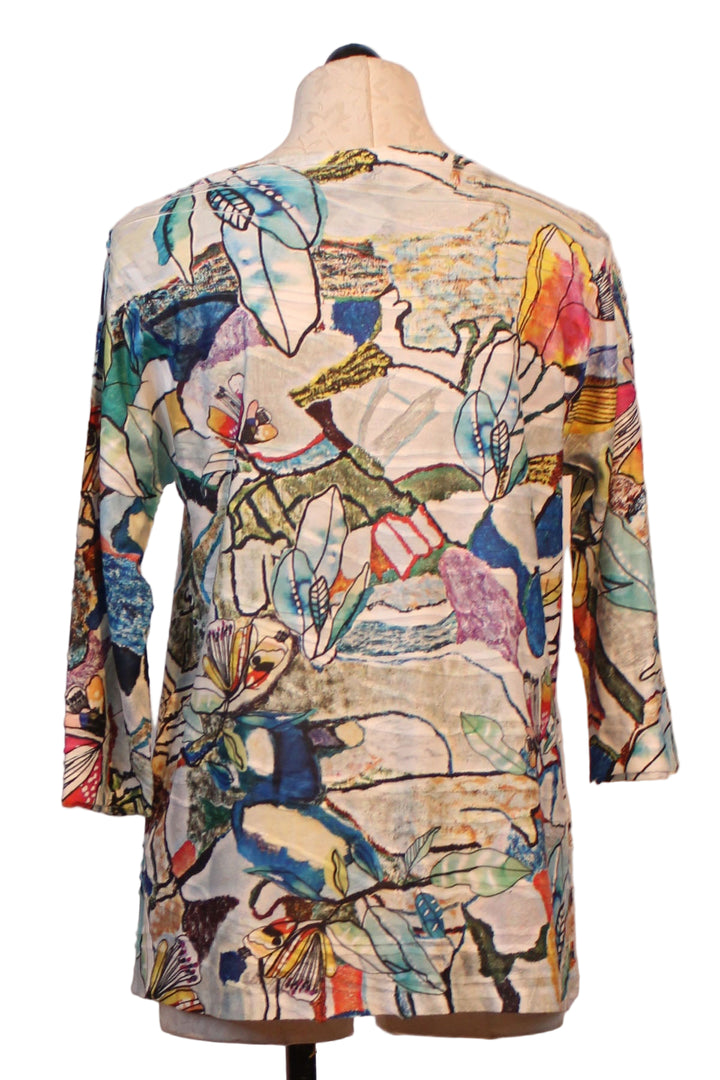 back view of Sweet Lily 3/4 Sleeve Crew Neck Assymetrical Hem Top by Inoah
