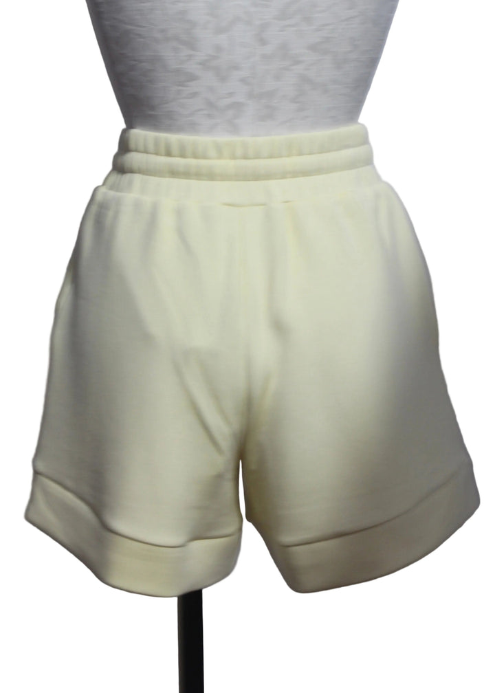 back view of The Anise Flower Atrium High Rise Short 4.5 by Varley 