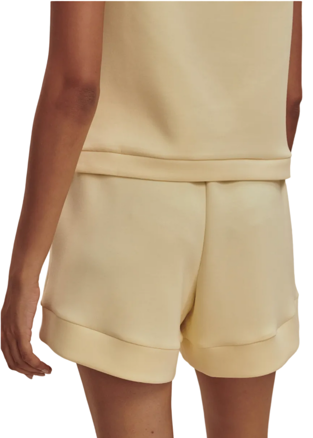 back view of model wearing The Atrium High Rise Short 4.5 In Anise Flower Color by Varley 