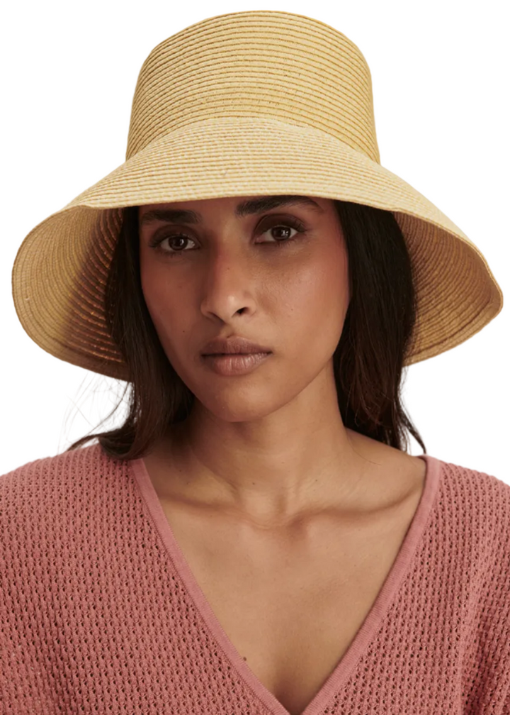 Modeling wearing the Goodwin Sunhat by Varley in Anise Flower