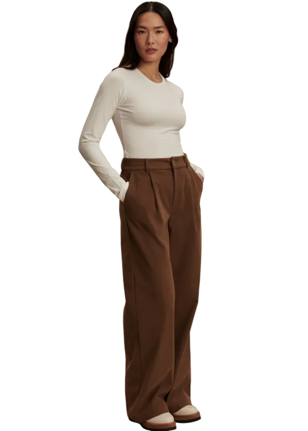 full view of model wearing the white Edna Long Sleeve Fitted Tee by Varley