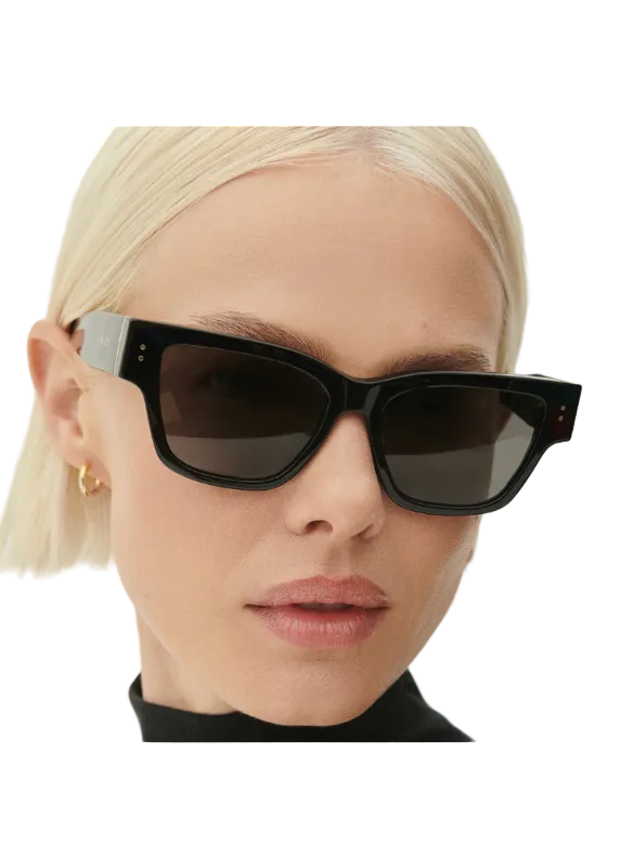 Model wearing the black Alber Square Sunglasses by Varley
