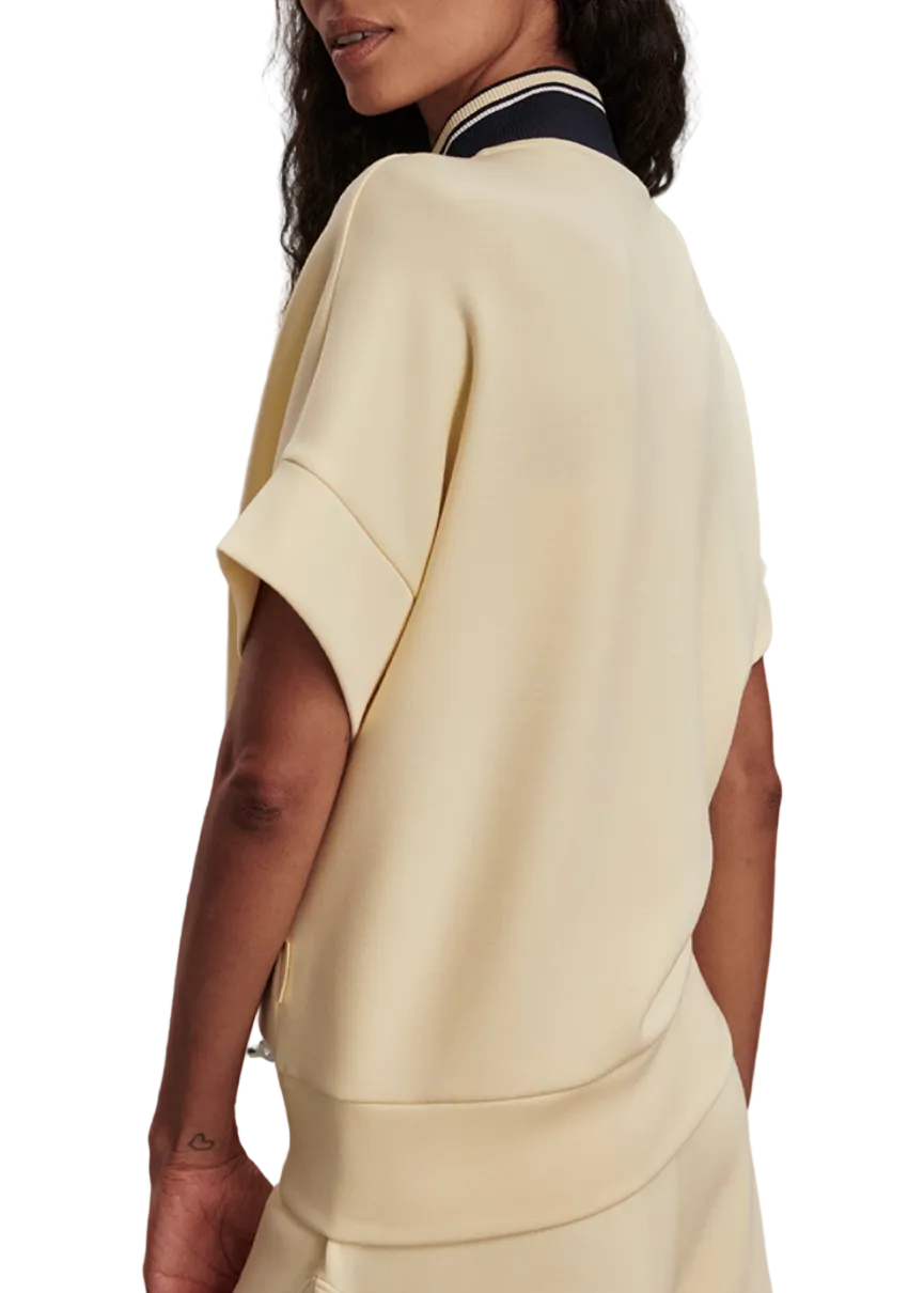 back view of Model wearing the Ritchie Short Sleeve Sweat 2.0 by Varley in Anise Flower