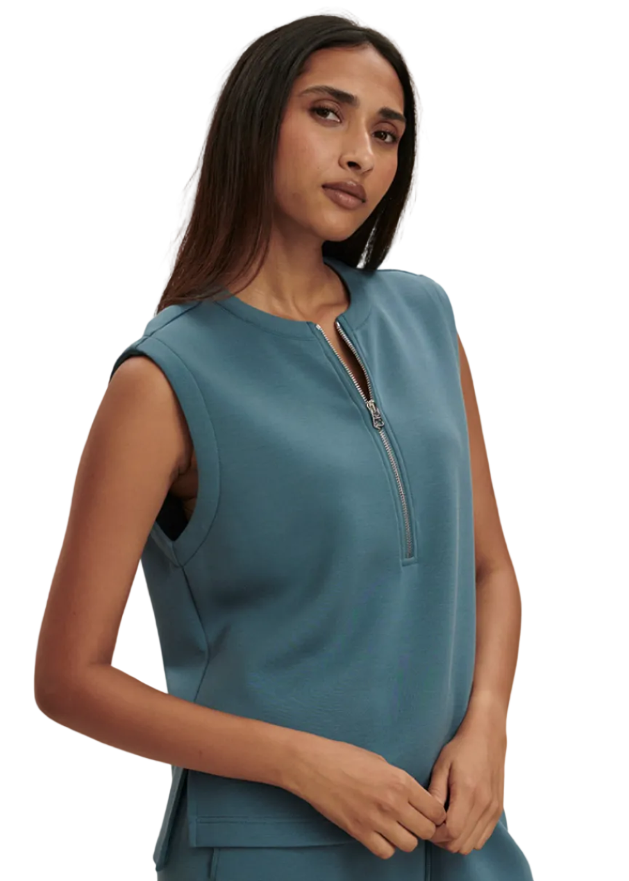 model wearing the Simmons Half Zip Tank by Varley in Mallard Blue