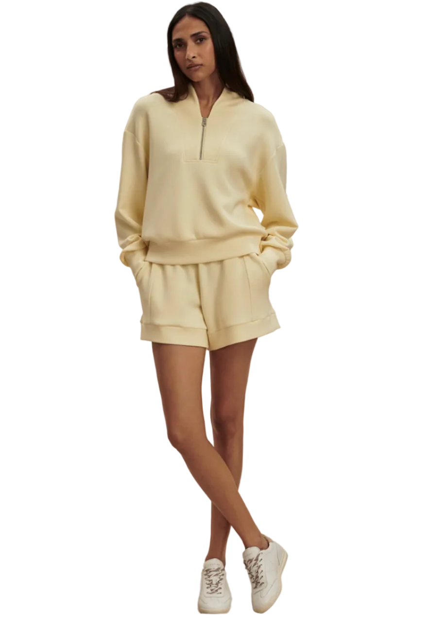 Model wearing the The Davidson Sweat in Anise Flower by Varley paired with The Atrium High Rise Short 4.5 In Anise Flower Color by Varley 