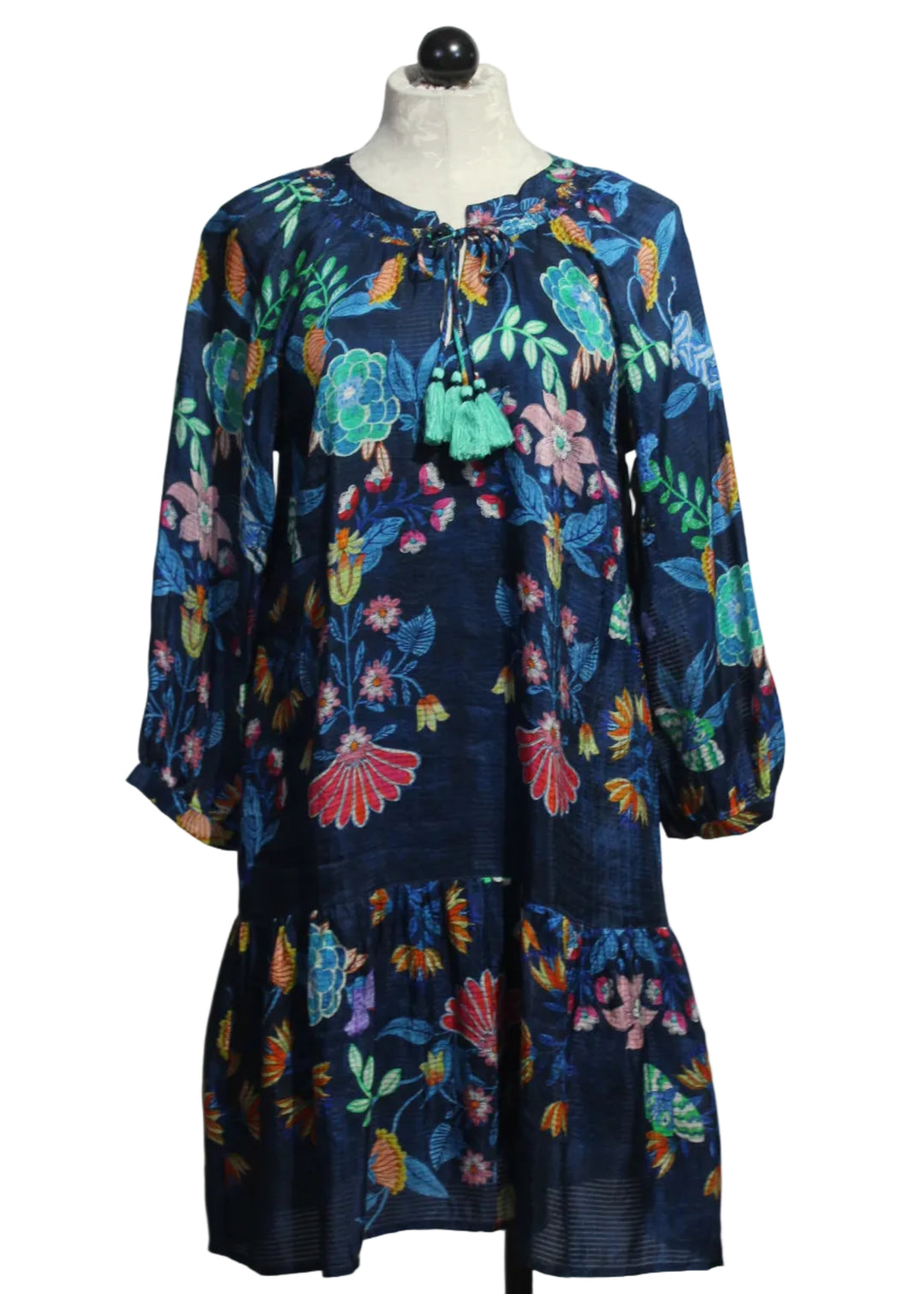 The Tassel Dress by Johnny Was in the bright blue floral Elizabeth print with turquoise blue tassels