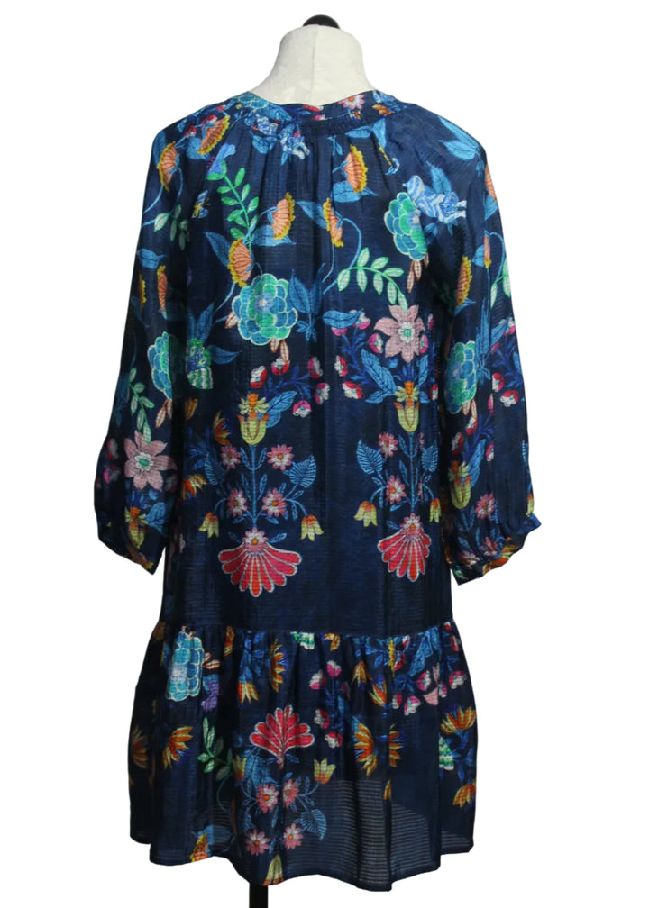 back view of The Tassel Dress by Johnny Was in the bright blue floral Elizabeth print with turquoise blue tassels